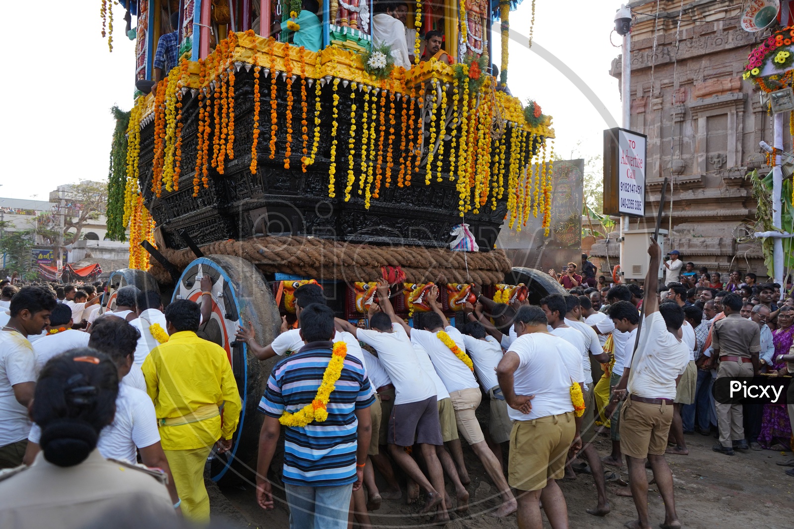 Indian Devotees Pulling The Chariot Of a Hindu God  Sri Panakala Lakshmi Narasimha Swamy at a Procession