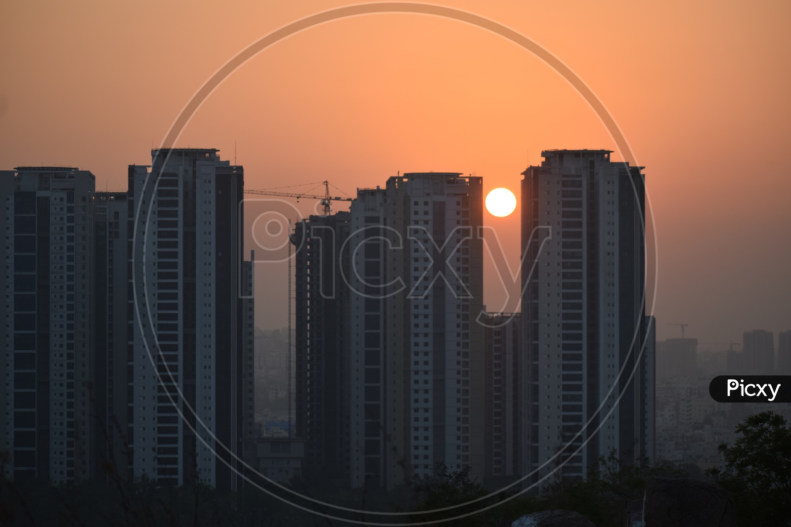 Sunset Over High Rise Construction Buildings