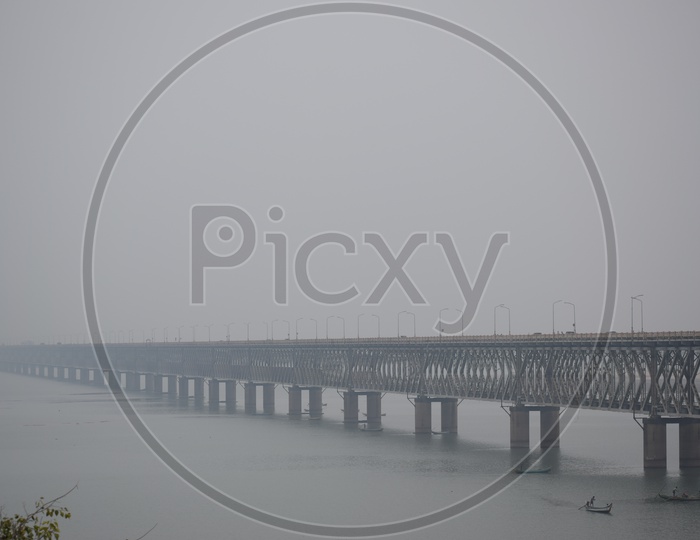 Fisherman Boats In The Goadavari River  At Godavari Bridge In a Foggy Morning