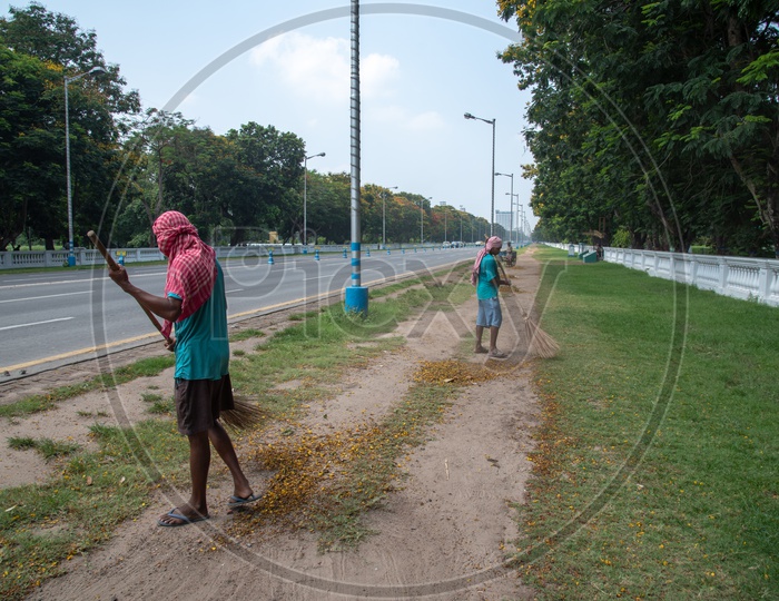Sanitary Or Municipal Corporation Workers Cleaning the Road Premises At Red Road