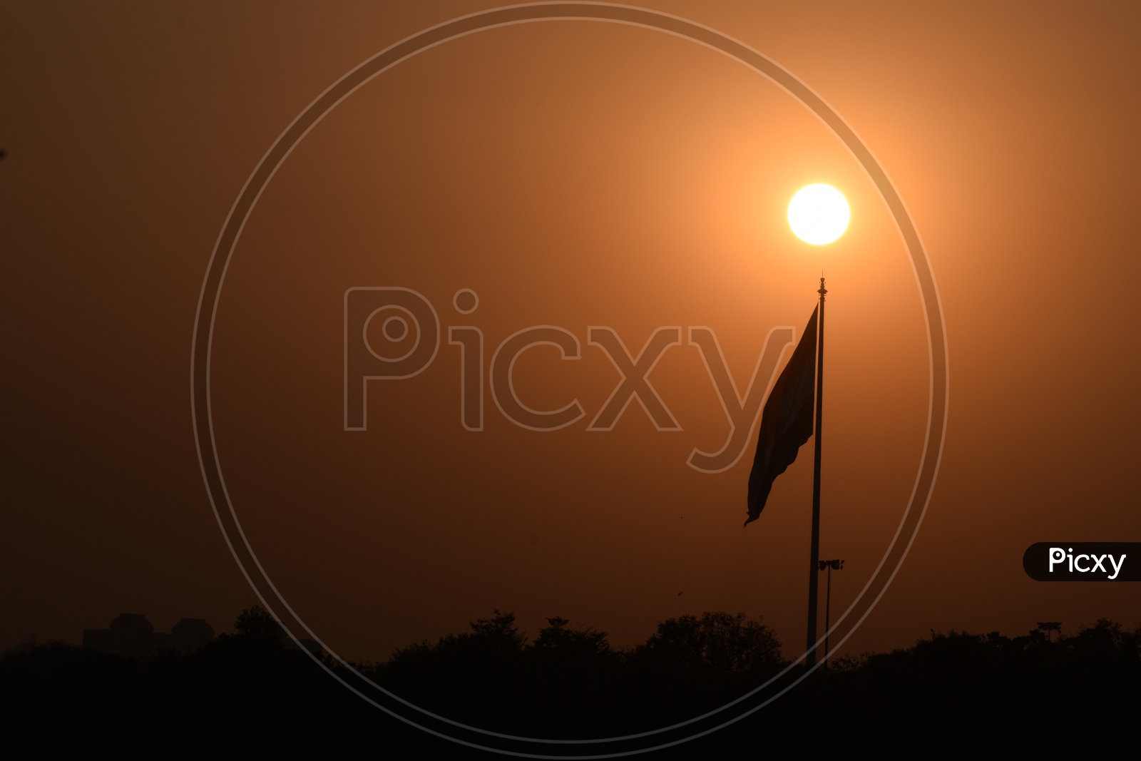 Silhouette Of a Flag Pole  Over a Sunset