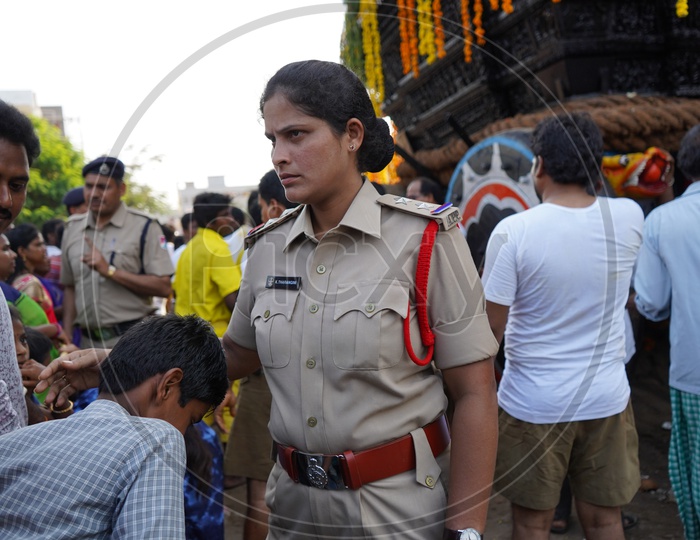 Sub Inspector Of Police K, Tarangini   Or Lady Police In Duty  At a Hindu God Procession