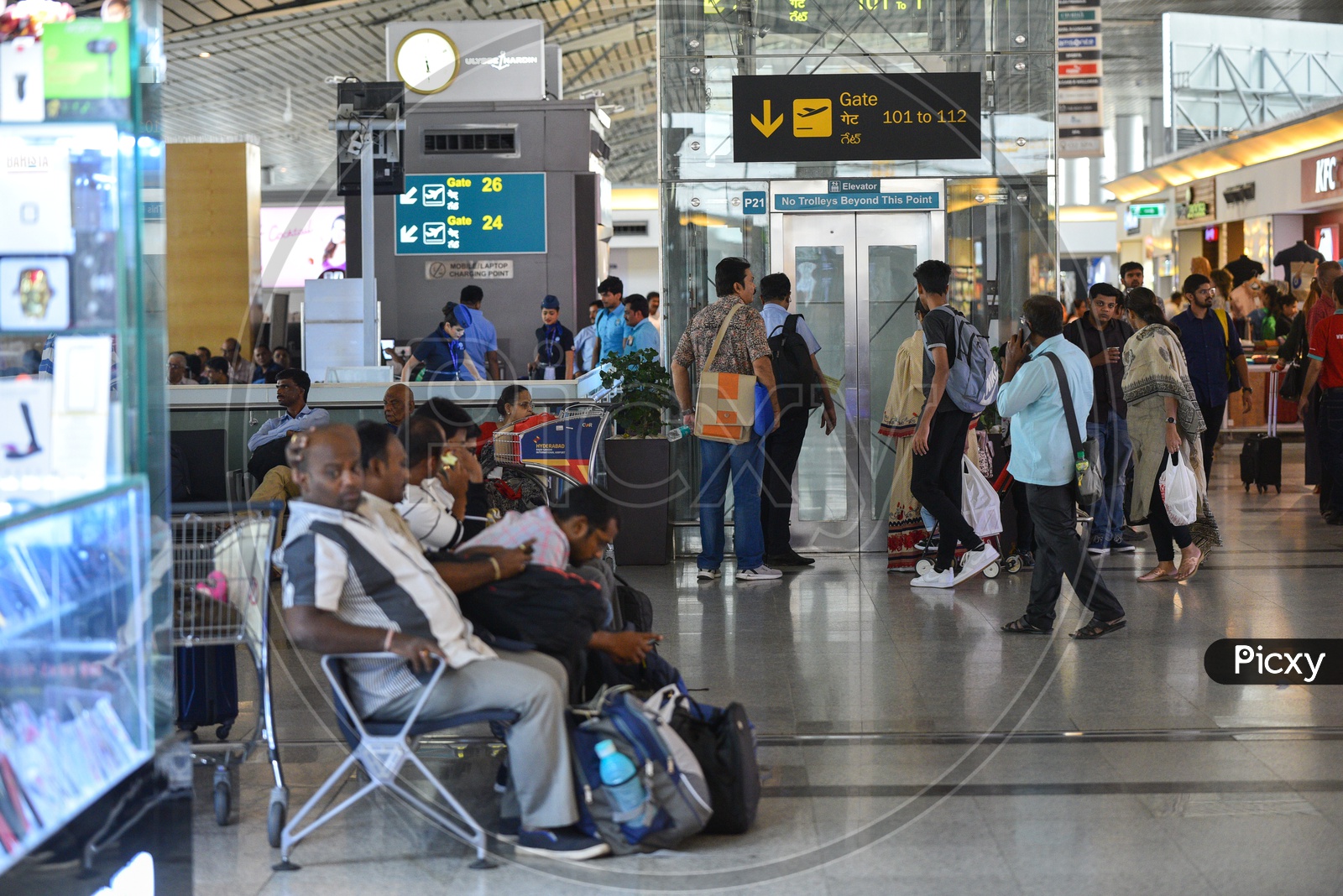 Airport scenes  With Passengers Waiting In  Waiting Lounge  And Departure Display  Screens