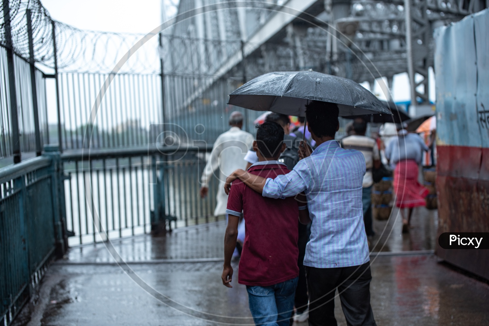 Pedestrians Taking  Cover  Using  Umbrellas In Heavy Rain Due To  Cyclone  Fani   At Howrah  Bridge