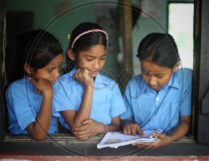 School Students Or School Children Wearing The Uniform And Listening To Class in a Classroom