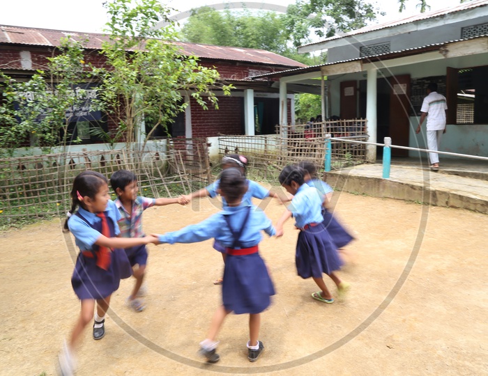 School Students or School Children Wearing School Uniforms And Happily  Playing With  Smile Faces In School Premise