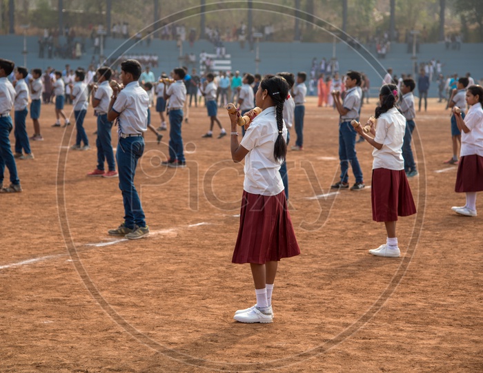 Indian School Children In Uniforms  Doing Exercises by Standing In Queue Lines In Drill Period Or Pet Period