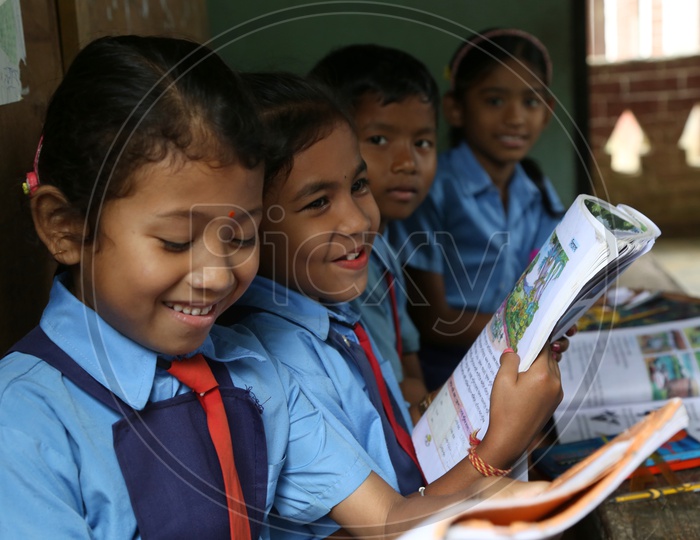 School Children  or School Students In a Classroom Wearing  School Uniforms With Books  in a Rural Village School