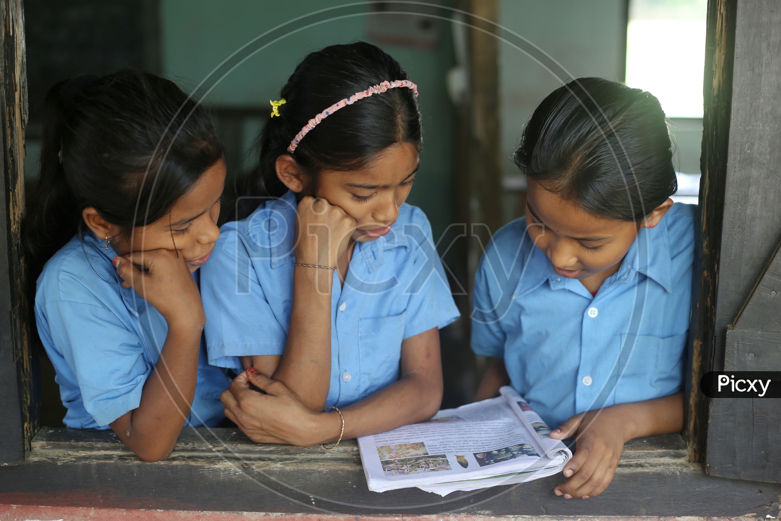 School Students Or School Children Wearing The Uniform And Listening To Class in a Classroom