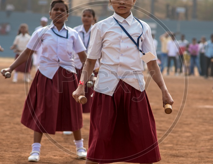 Indian School Children In Uniforms  Doing Exercises by Standing In Queue Lines In Drill Period Or Pet Period