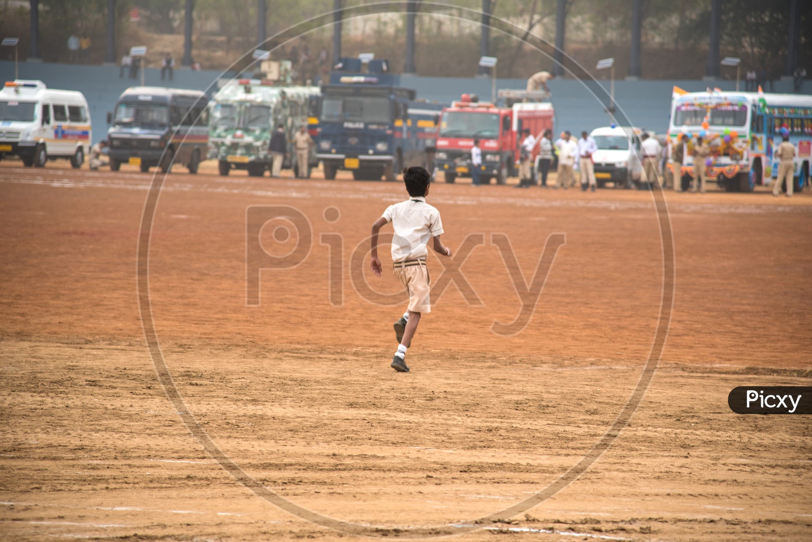 A School Boy Running In a Ground