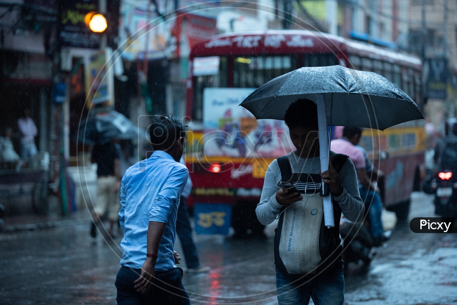 Pedestrians  Holding  umbrellas And Taking Cover from Heavy  Rain  Duer To Cyclone  Fani  on  Howrah  Roads