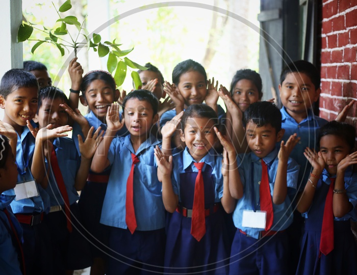 School Children Or School Students Wearing School Uniforms   With Smiling Faces and Having Fun and Joy in School