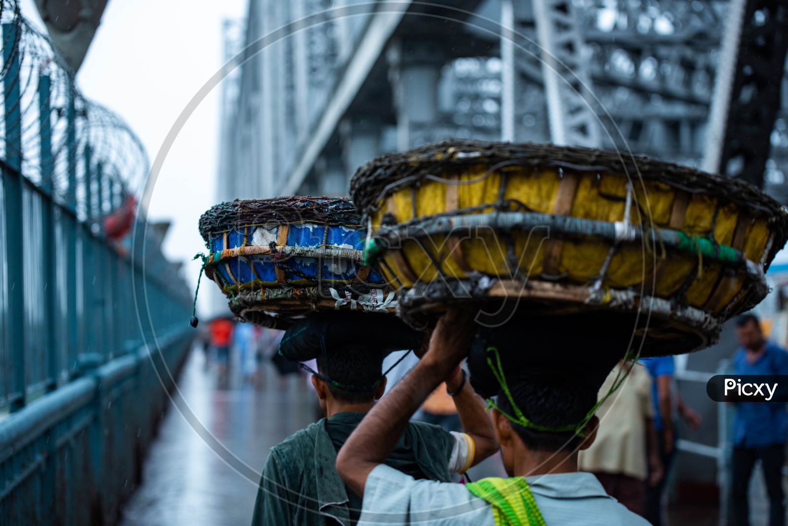Vendors Carrying The Baskets On Their Heads  At Howrah Bridge