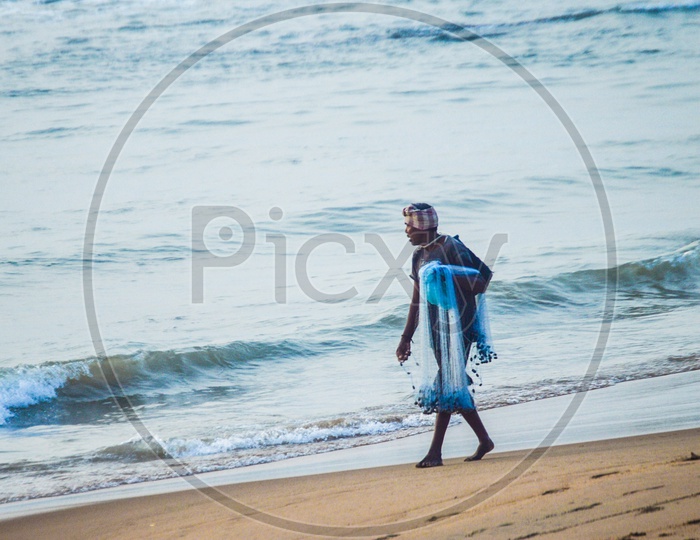A fisherman going to get his catch for the day
