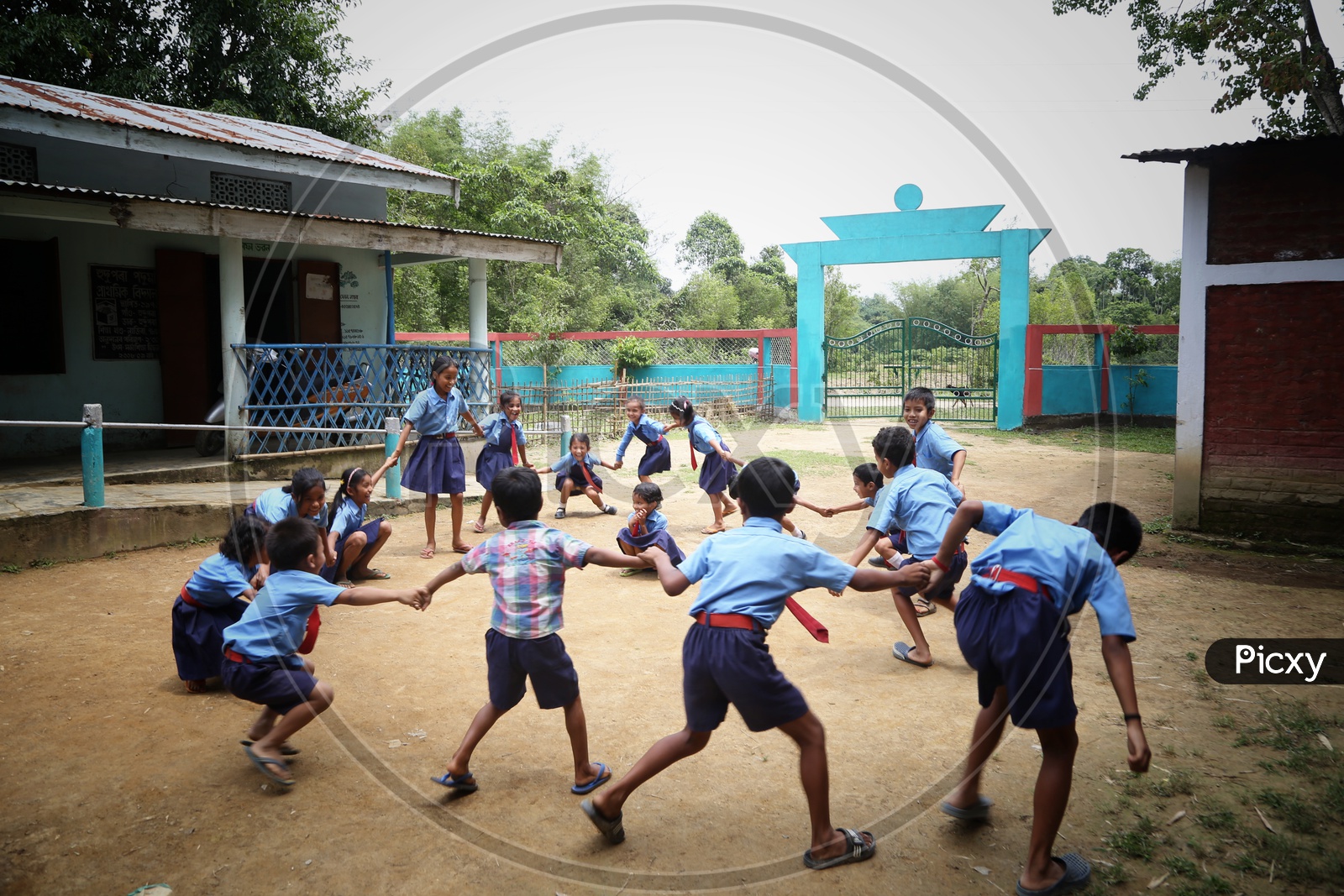 School Children Or School Students Wearing Uniforms With Happily Smiling Faces  Playing In  A School Premise Or Compound