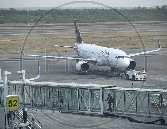 Vistara  Flight  Parked In An Airport