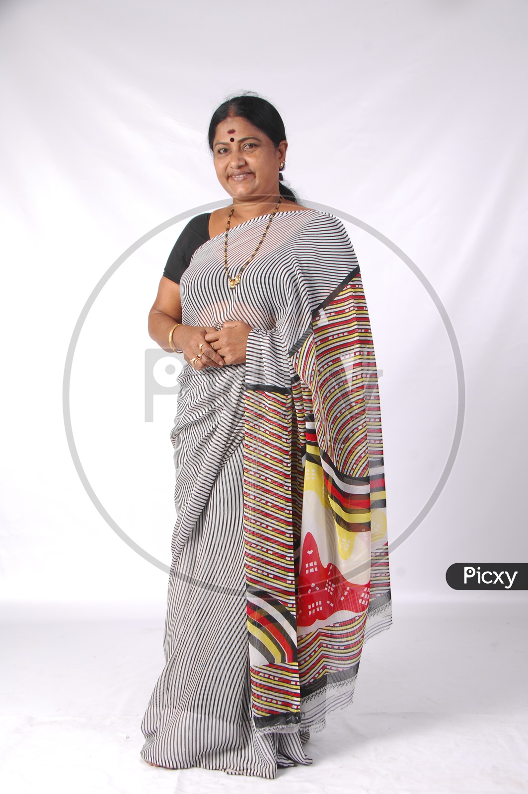 An Indian Woman In Casual Saree or Sari   With A Smile Face on an Isolated White Background