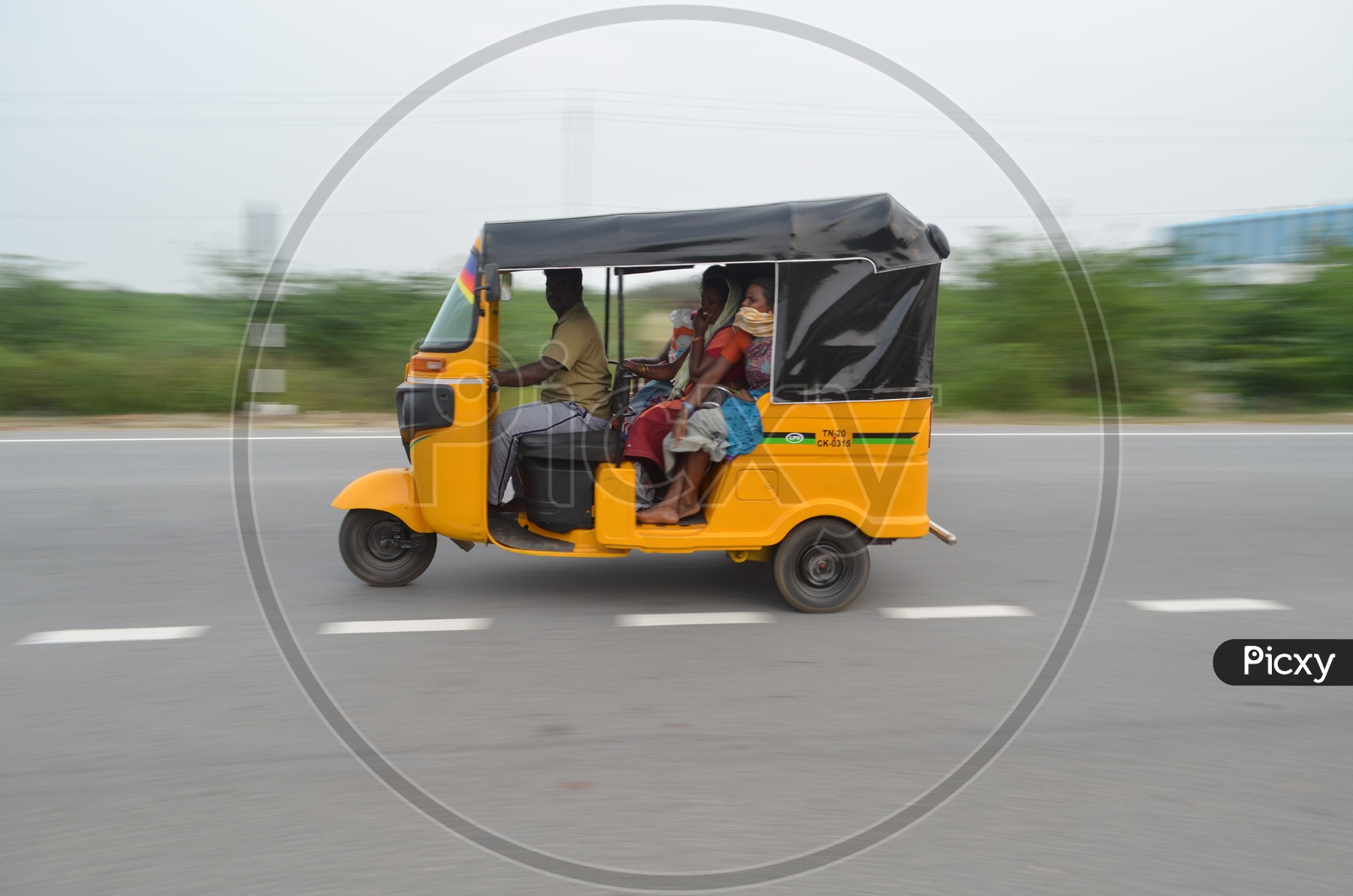 A  Fast Moving Auto or Tuk-Tuk on Highway Roads