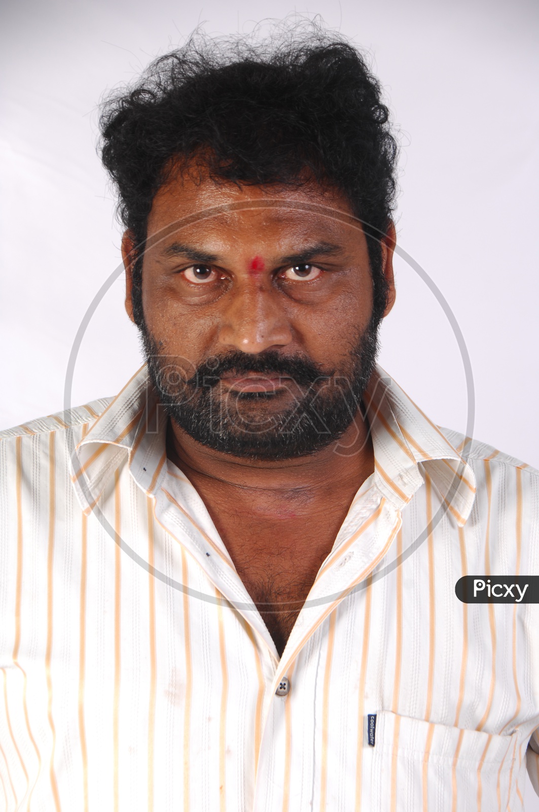 Portrait Of a Indian Man Or Tollywood Movie Character Artist In Casual Dress On an Isolated White Background