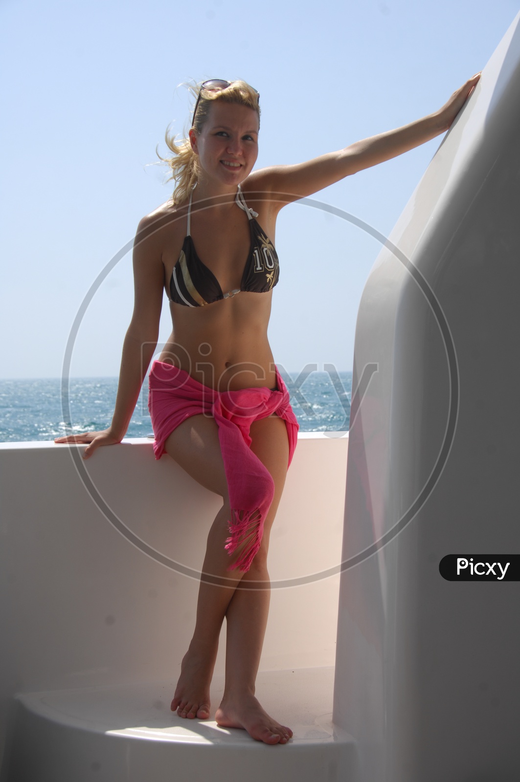 Woman Wearing  Swim wear And Posing in a Yacht