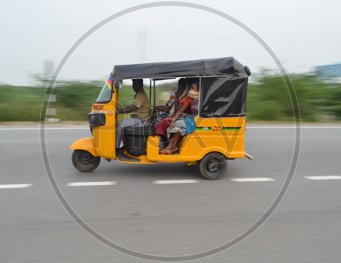 A  Fast Moving Auto or Tuk-Tuk on Highway Roads