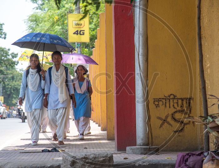 School Girls Taking Shade by Using Umbrellas From Bright Sun While Going To School in Ranchi