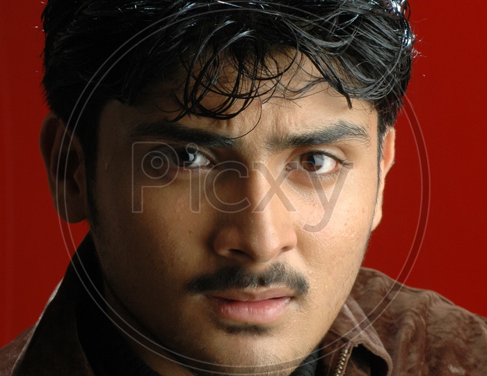 A Young Indian Man Portrait With an Expression On Face  Over an  Isolated Background