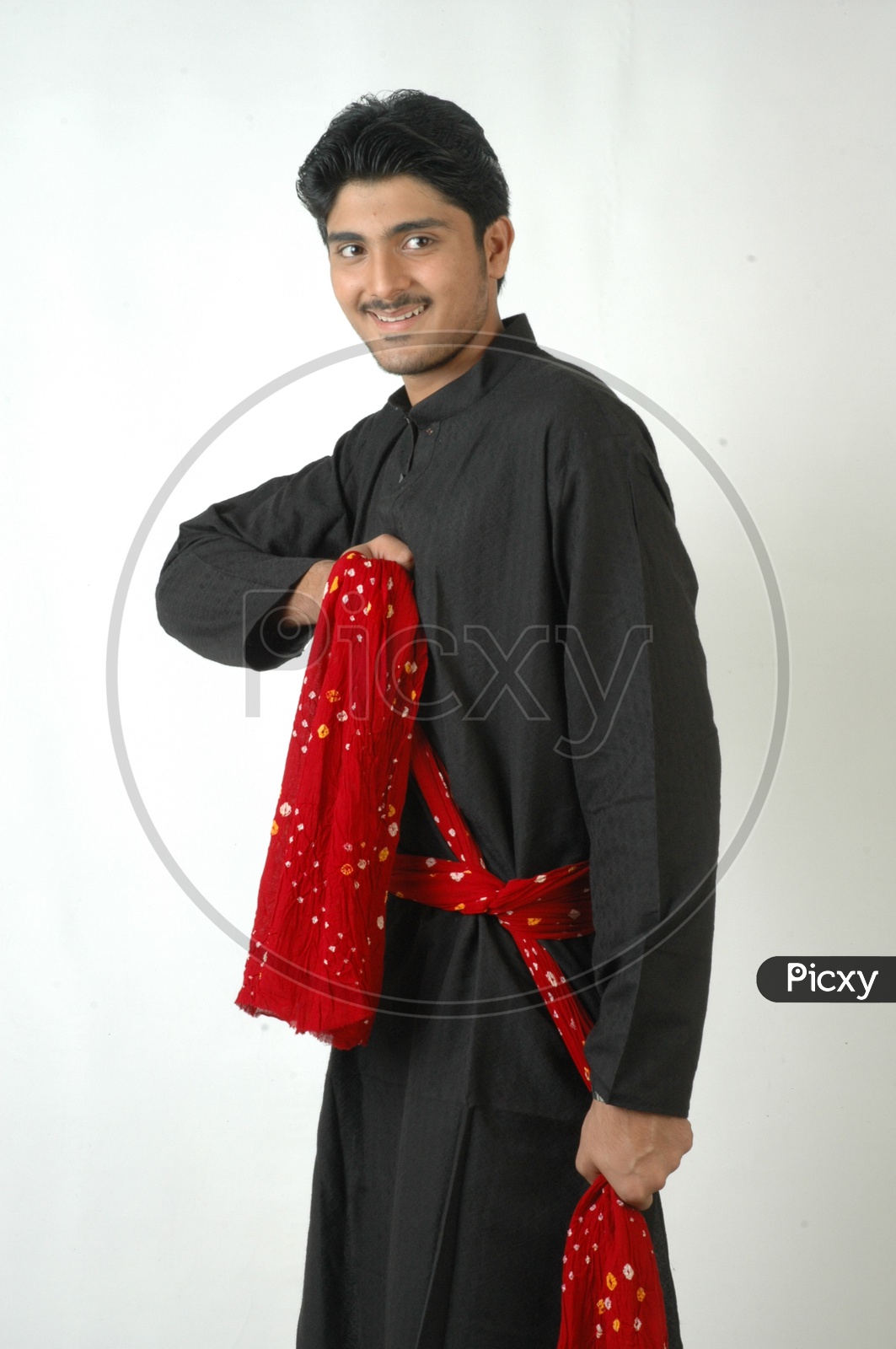 A  Young Indian Man In traditional Wear  or Pyjama  and Posing With a Smile Face On an Isolated White Background