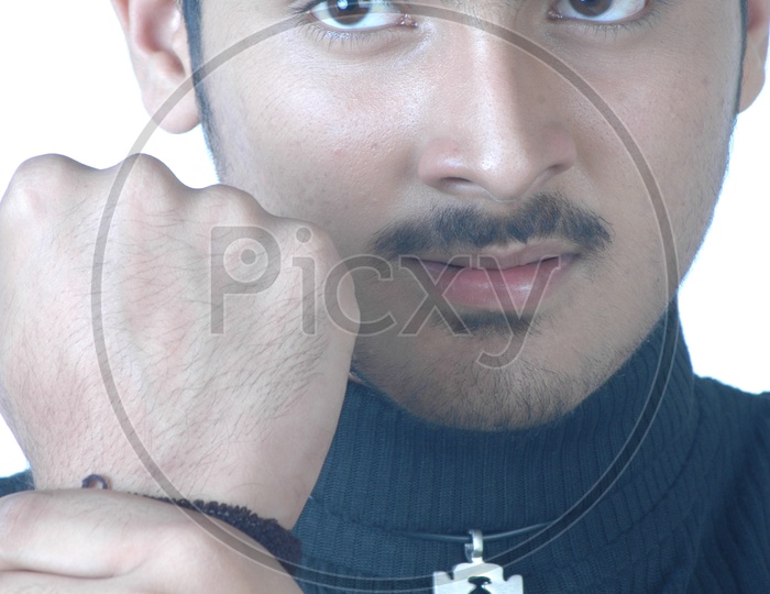 Portrait Of a Angry Indian Young Man  With His Fist Tripping  For Fight  And With a Expression On an Isolated White Background