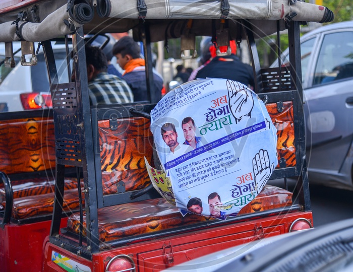 Congress party flags on the tuk tuk or auto on Mahatma Gandhi Main Road in Ranchi