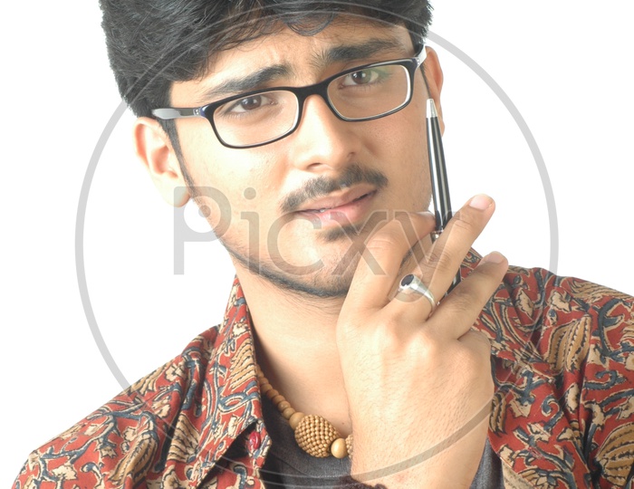 Portrait Of a Young Indian Man  With an Expression And Posing On an Isolated White Background