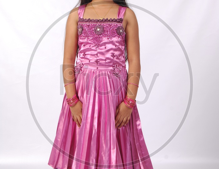 Portrait Of a Cute and Chubby indian Girl Child With Smile Face On an Isolated White Background