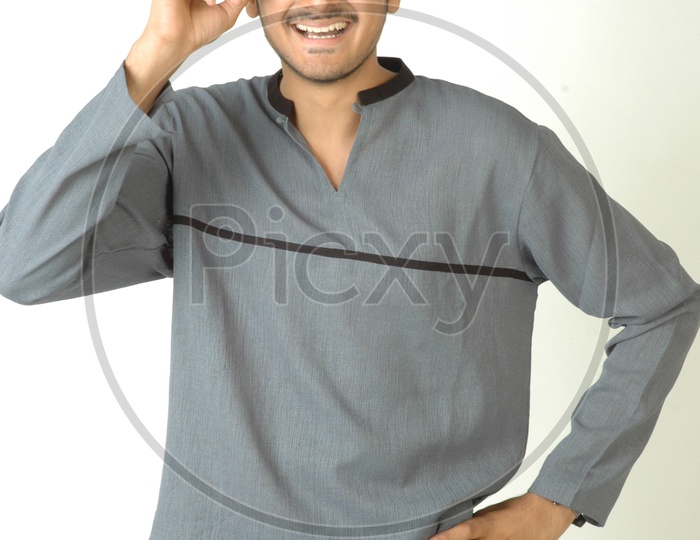 Portrait Of a Young Indian Man  With an Expression and Smile On Face  And Posing On an Isolated White Background