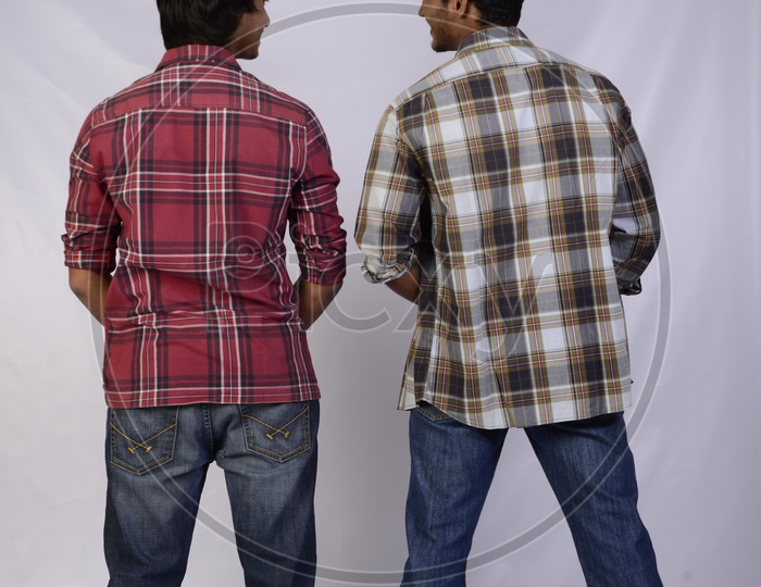 A Couple Of Boys or Friends Passing Urine   And Chatting  On an Isolated  White Background