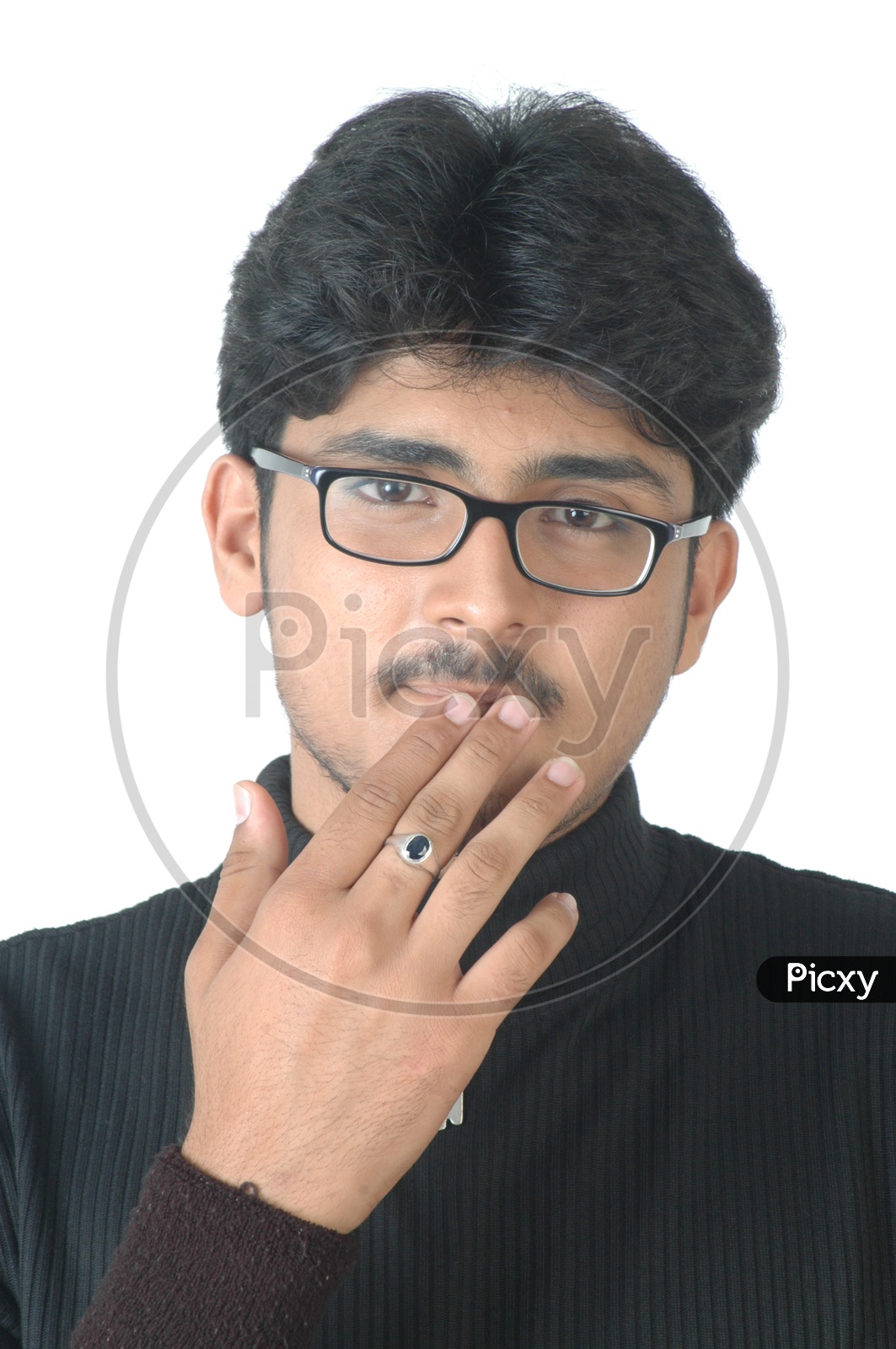 Portrait Of a Young Indian Man  With an Expression  Wearing Spectacles And Posing On an Isolated White Background