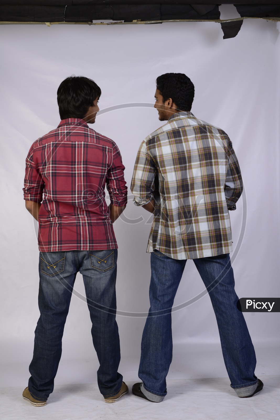 A Couple Of Boys or Friends Passing Urine   And Chatting  On an Isolated  White Background
