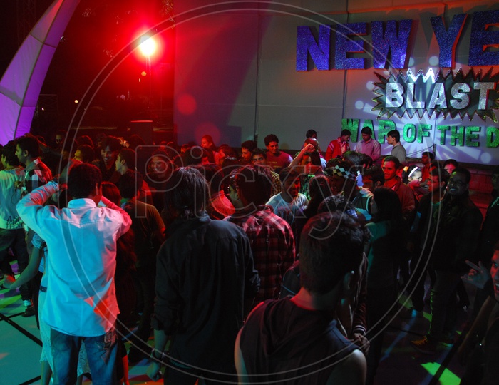 Group Of Young People Dancing In a Disco on a new Year Event