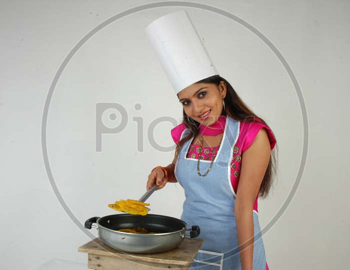 An Indian Woman Cooking Jalebi Or Jilebi Sweet On an Isolated White Background