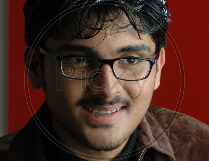 Portrait of a Indian Young Man With an Expression on Face  Over an Isolated white Background