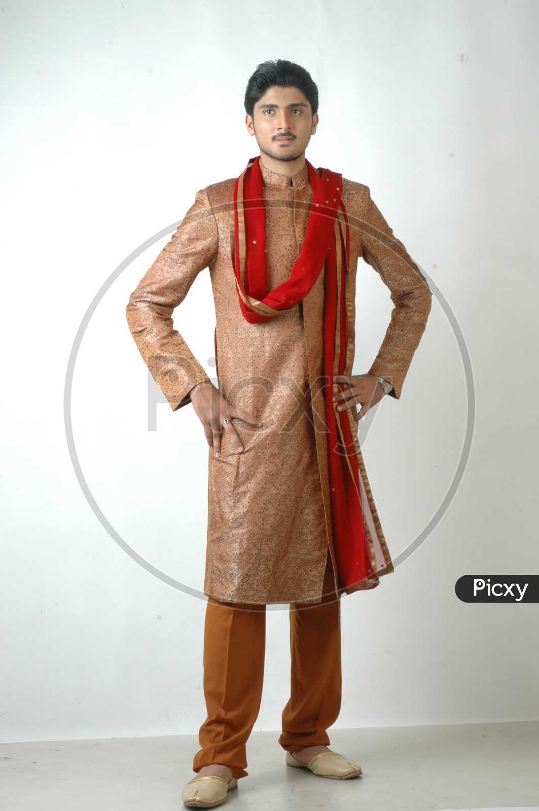 Premium Photo | Indian man in traditional wear or kurta, pyjama cloths.  male fashion model in sherwani, posing or standing against brown grunge  background, selective focus