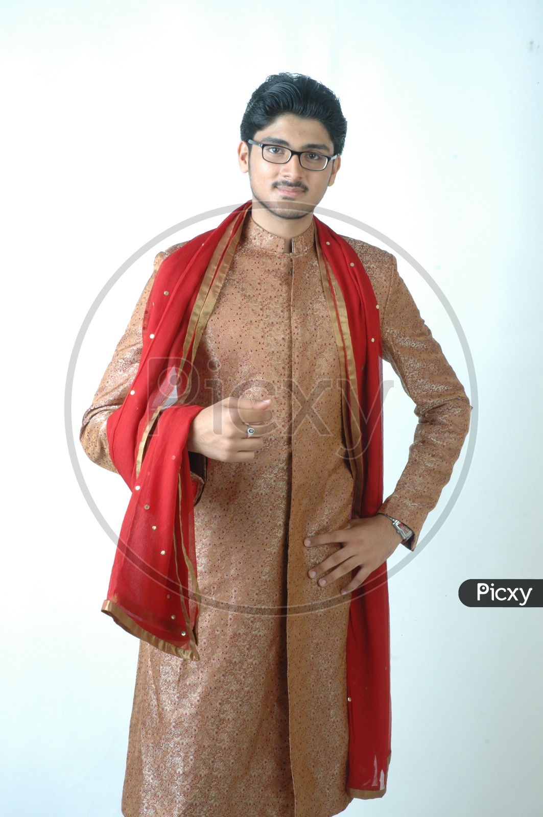 A  Young Indian Man In traditional Ethnic  Wear  or Sherwani   and Posing With a Smile Face On an Isolated White Background