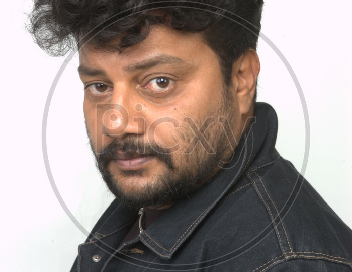 South Indian Actor Sai Kumar  Standing and Posing on an Isolated White Background