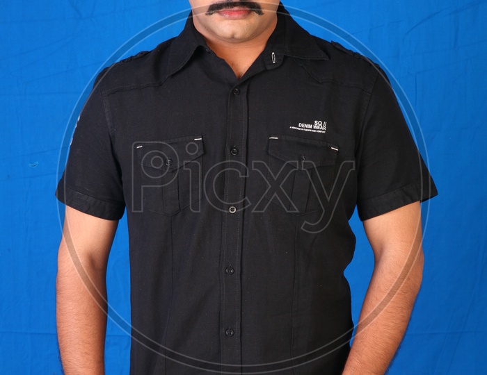 Portrait Of an Indian Man  With an Expression On an Isolated Blue Background