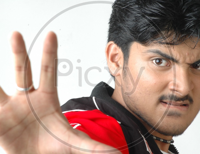 Portrait Of a Young Indian Man  With an Expression And Posing On an Isolated White Background