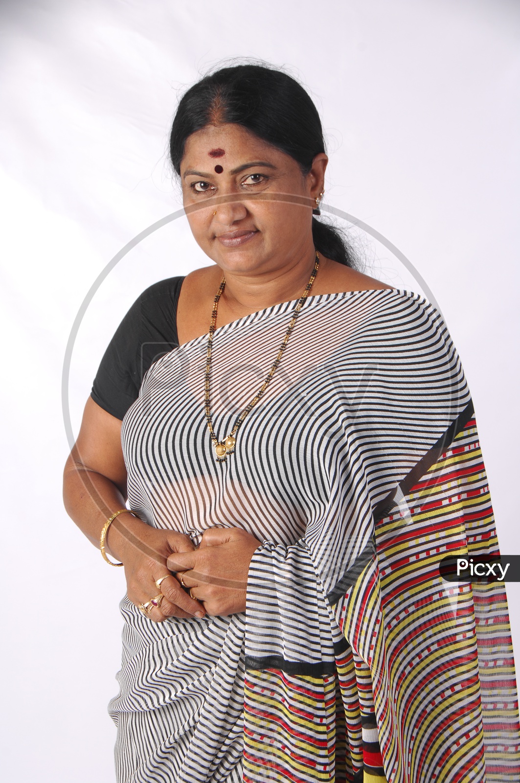An Indian Woman In Casual Saree or Sari   With A Smile Face on an Isolated White Background