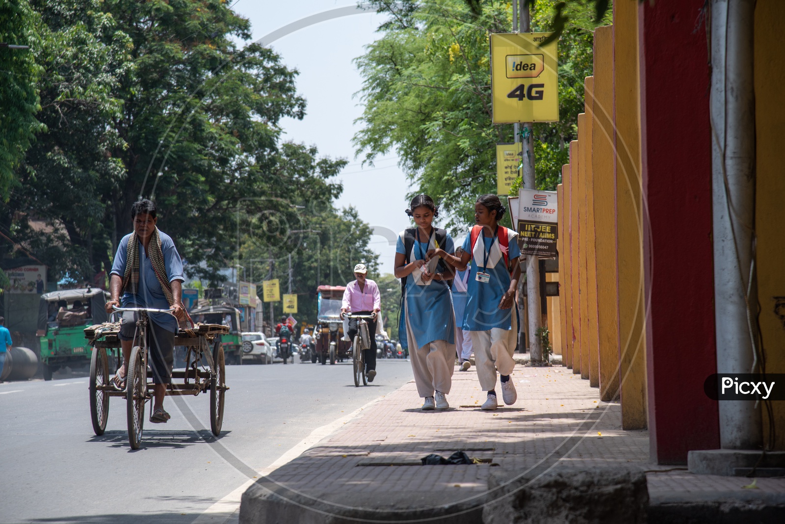 School Girls In Uniforms  Walking  on Footpaths While Going To School