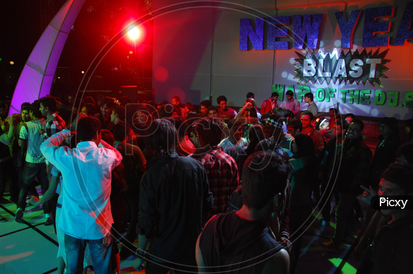 Group Of Young People Dancing In a Disco on a new Year Event