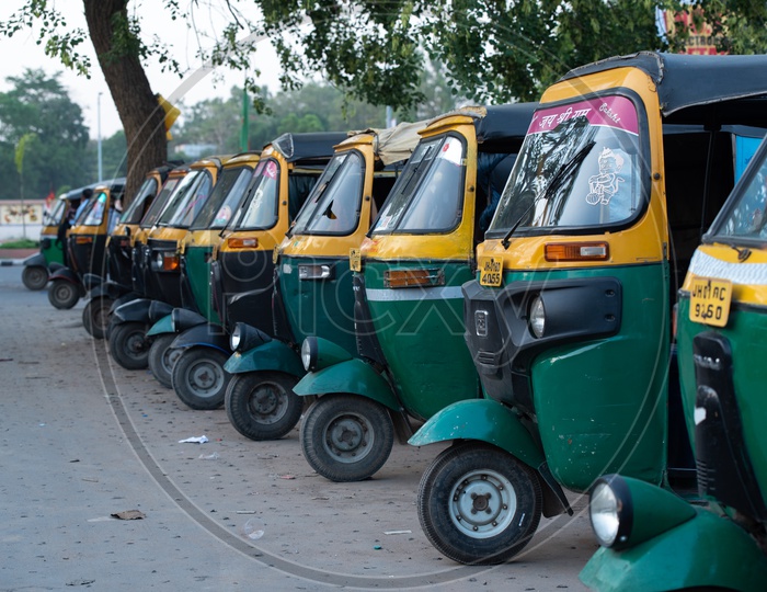 Green LPG  Autos  Parked In an Auto Stand
