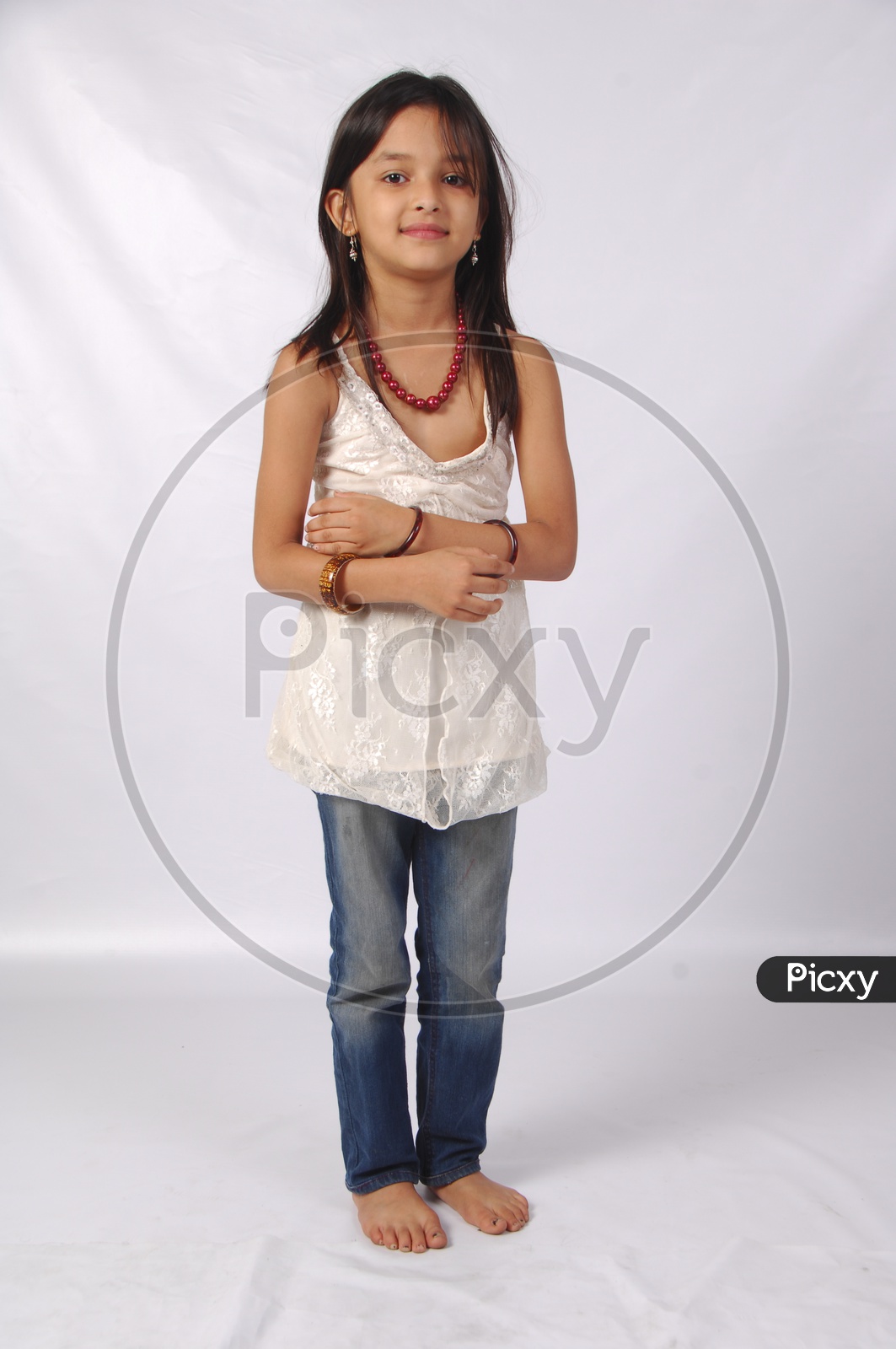 Portrait Of a Cute and Chubby indian Girl Child With Smile Face On an Isolated White Background